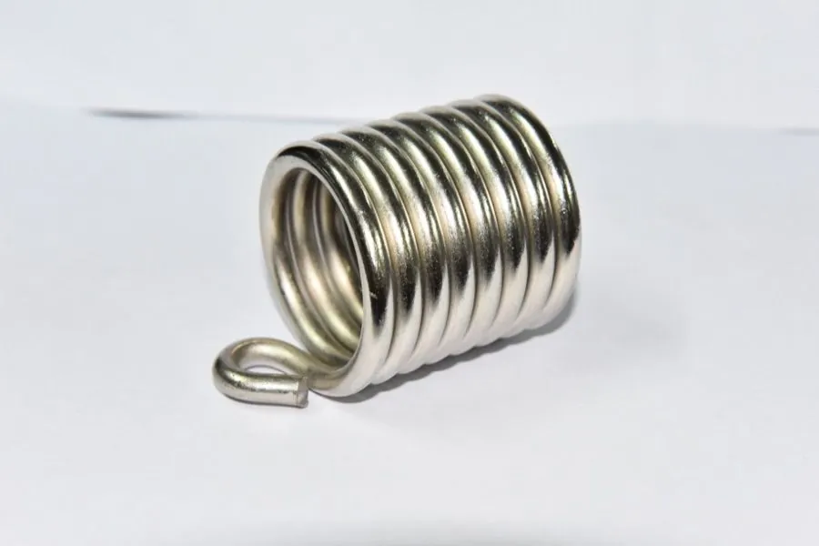 Torsion springs with straight and bent legs